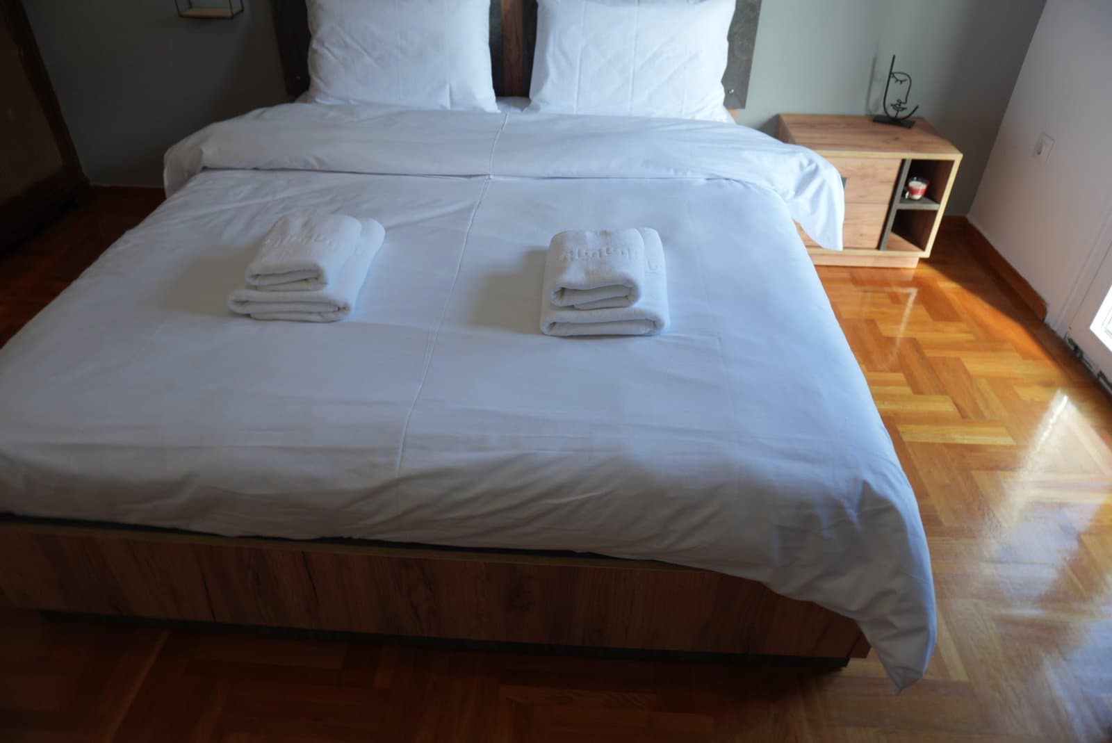 A bedroom in one of the apartments we furnish and host, made up for arrival